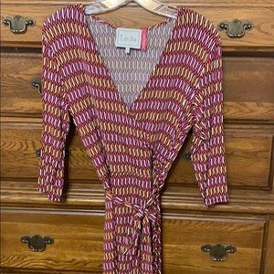 Faux wrap dress in pink/orange pattern